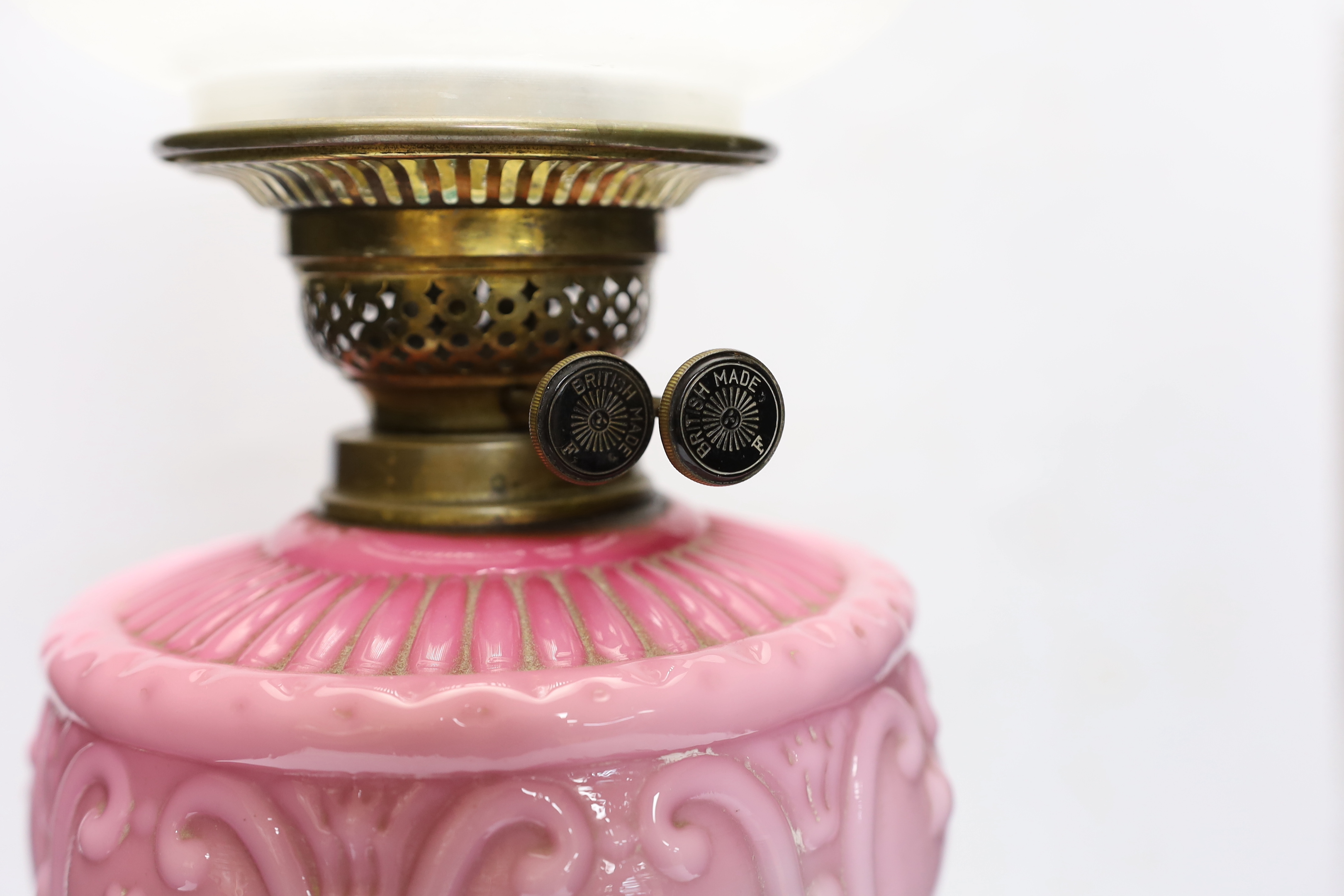 A late 19th century pink and white glass oil lamp, 73cm high